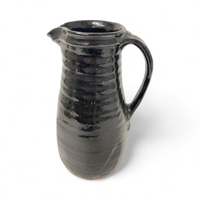 Lot 1900 - Large St. Ives Pottery jug, black glazed, with impressed marks including initials 'JB', probably for John Bedding (apprentice of Bernard Leach), 34.5cm high