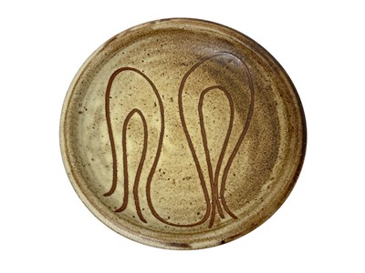 Lot 1901 - Mousehole Pottery dish, with incised abstract design, impressed mouse mark to base, 21.5cm diameter Nb: Mousehole Pottery was established by Bill and Biddy Picard in 1955, after encourag...