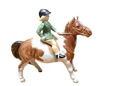 Lot 2222 - Beswick figure of a girl on a skewbald horse