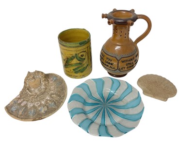 Lot 1911 - Group of ceramics and glass, including a Doulton Lambeth puzzle jug, a yellow and green glazed tankard, a relief decorated wall appliqué, etc (5)