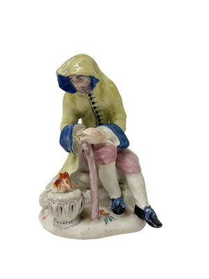 Lot 1913 - Bow Porcelain Figure of Winter, circa 1755, as a bearded man seated beside a brazier, polychrome painted, inscribed mark to base, 12.5cm high