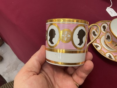 Lot 54 - Coalport trio, unusually painted with profile silhouettes, on a pink ground, circa 1805, pattern number 360