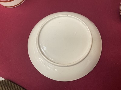 Lot 54 - Coalport trio, unusually painted with profile silhouettes, on a pink ground, circa 1805, pattern number 360