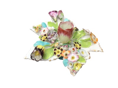 Lot 260 - Staffordshire porcelain flower applied chamber candlestick, circa 1850