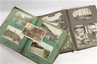 Lot 2443 - PostCarsds in two albums - including real...