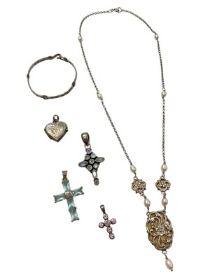 Lot 967 - Silver and cultured pearl pendant necklace, three silver gem set cross pendants, silver heart locket and a white metal christening bangle