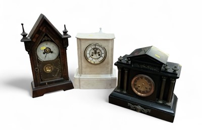 Lot 421 - Victorian slate mantel clock, a white marble mantel clock, and a Gothic style American clock (3)
