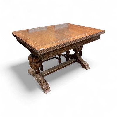 Lot 1360 - 1930s oak draw leaf table and set of four chairs