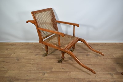 Lot 1244 - Antique teak and caned plantation chair