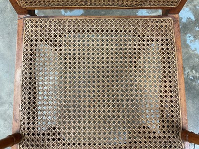 Lot 1244 - Antique teak and caned plantation chair