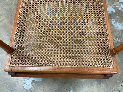Lot 1244 - Antique teak and caned plantation chair