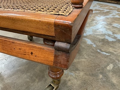 Lot 1244 - Antique teak and caned plantation chair