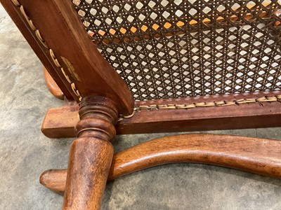 Lot 1244 - Antique teak and caned plantation chair