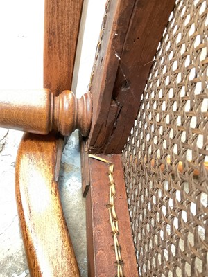 Lot 1244 - Antique teak and caned plantation chair