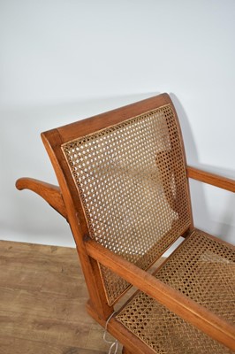 Lot 1244 - Antique teak and caned plantation chair