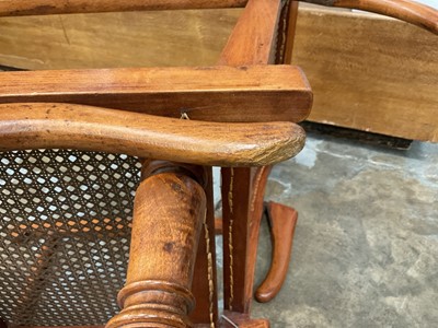 Lot 1244 - Antique teak and caned plantation chair