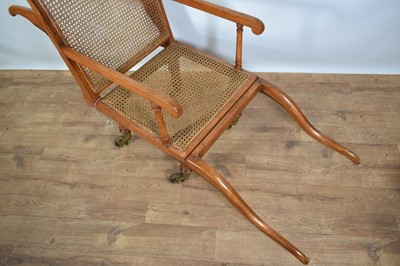 Lot 1244 - Antique teak and caned plantation chair