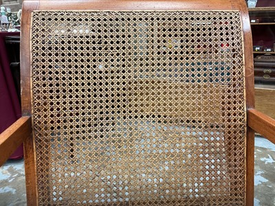 Lot 1244 - Antique teak and caned plantation chair
