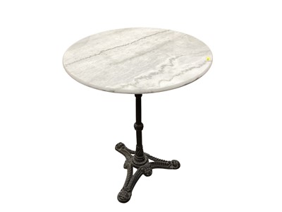 Lot 1304 - Cast iron table base with circular marble top, 60cm diameter, 71.5cm high