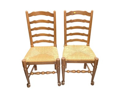 Lot 1402 - Nine ladderback kitchen chairs with rush seats