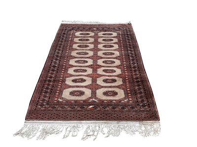 Lot 1497 - Eastern rug with 16 medallions