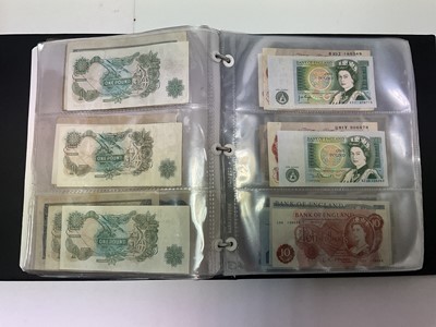 Lot 403 - World - Three albums containing a quantity of mixed coins, banknotes & stamps to include some silver (Qty)