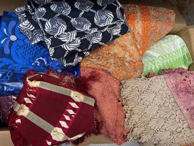 Lot 313 - Four boxes of patterned fabrics, materials and women's clothing