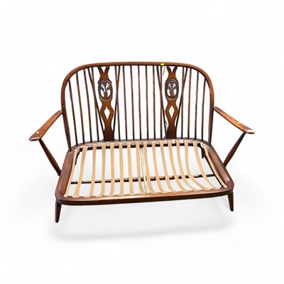 Lot 1430 - Ercol stick back sofa