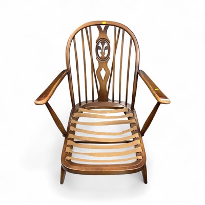 Lot 1433 - Ercol stick back armchair together with another Ercol armchair(2)