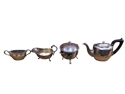 Lot 703 - Group of silver plate to include teapots, sugar caster, toast rack and others