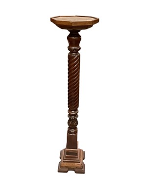Lot 1351 - Mahogany torchère with octagonal top, 132cm high