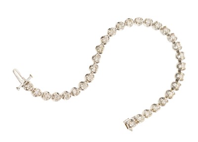 Lot 570 - Diamond tennis bracelet, 31 brilliant cut diamonds estimated to weigh approximately 5cts, in 14ct white gold setting