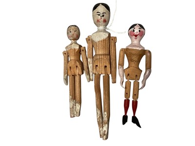 Lot 2043 - Three antique / vintage carved and painted wooden peg dolls with jointed limbs