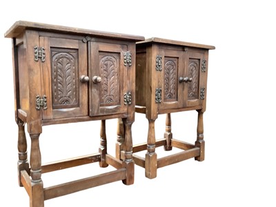 Lot 1377 - Pair of Bevan Funnell Reprodux two door oak cupboards with carved decoration, 50.5cm wide, 33cm deep, 68cm high