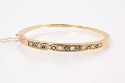Lot 718 - Victorian style diamond and sapphire hinged bangle in 9ct gold setting