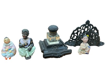 Lot 213 - Three bisque nodding head figures inkwell and letter rack