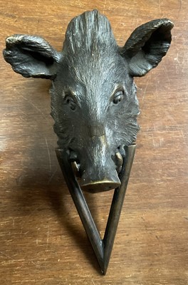 Lot 212 - Bronze door knocker, in the form of a boar's head