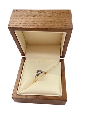 Lot 911 - Diamond single stone ring in platinum illusion setting with further diamond set shoulders on 18ct gold shank