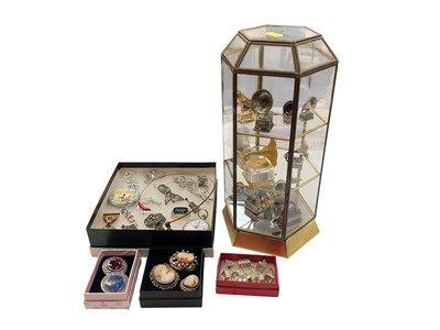 Lot 924 - Group of vintage brooches including some silver, two pocket watches, white metal charms and a collection of miniature gramophones in glazed display case