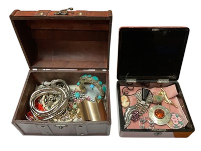 Lot 187 - Two boxes of vintage costume jewellery to include an articulated plated snake necklace, Art Deco style brooches etc