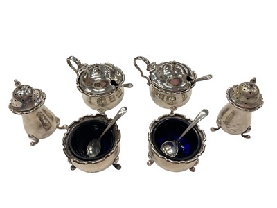 Lot 931 - Set of six silver condiments with blue glass liners and four silver salt spoons