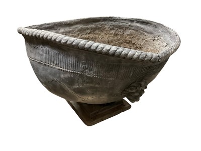 Lot 209 - Substantial antique lead planter, misshapen, with lion boss ornament on square stepped base, 25cm high
