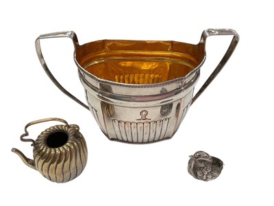 Lot 1031 - Edwardian silver chick pin cushion, together with an Old Sheffield plate sugar bowl and a miniature kettle. (3)