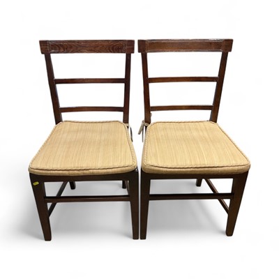 Lot 1438 - Four early 19th century country dining chairs with caned seats and loose cushions on taper legs