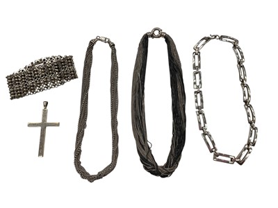 Lot 947 - Two silver multi-strand necklaces, one other contemporary silver necklace with long rectangular links, silver cross pendant and a silver (830) bracelet (5)