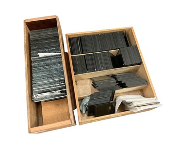 Lot 417 - Two boxes of glass negatives and magic lantern slides.