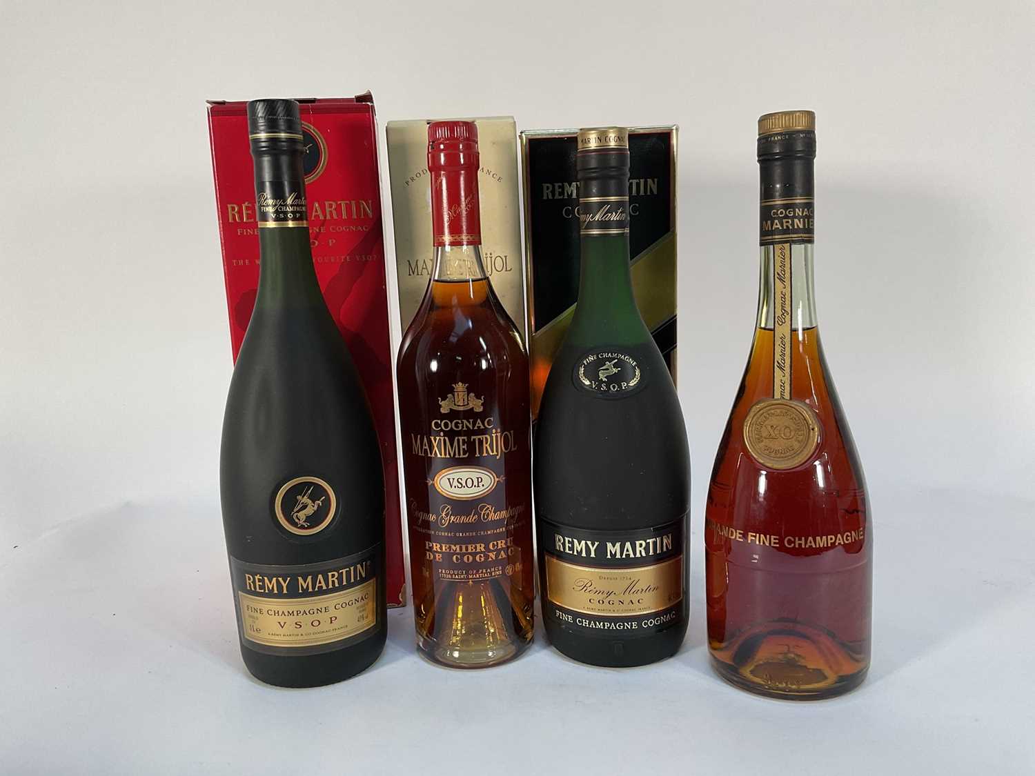 Lot 64 - Four bottles of Cognac, Remy Martin V.S.O.P (x2 1 litre), Maxime Trijol V.S.O.P Grande Champgane Cognac and Marnier-Lapostolle XO cognac
