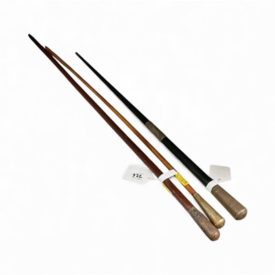 Lot 726 - Victorian conductor's baton with engraved military presentation inscription dated 1874, together with a late Victorian silver mounted swagger stick and one other swagger stick, (3).