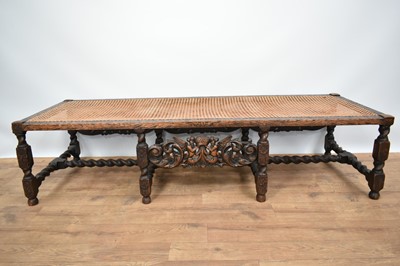 Lot 1229 - 1920s Jacobean revival oak framed stool with canework top