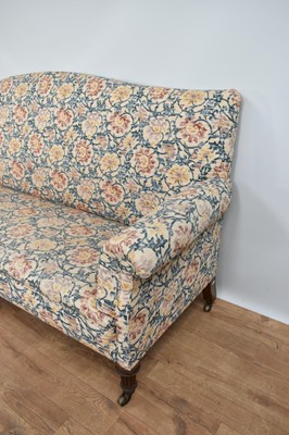 Lot 1227 - Edwardian sofa, arched back above scroll arms